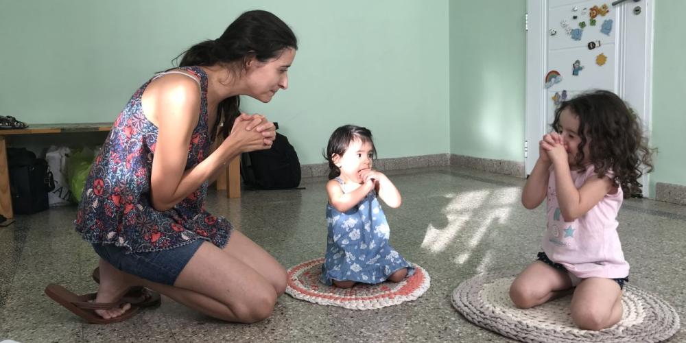 Abigail Darrichón Quinteros, 3, right, praying with her mother, María de los Ángeles, and little sister, Ali, at their home in Libertador San Martín, Argentina. (Evan Rolfe Oberholster)