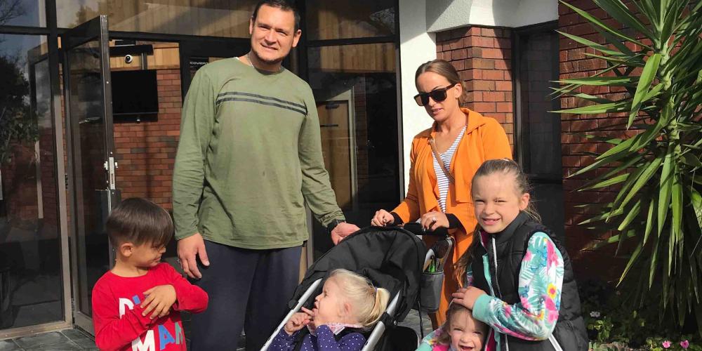 Former gangster Jayson Rogers with his wife, Krystal, and their four children at Papatoetoe Seventh-day Adventist Community Church in Auckland, New Zealand. (Victor Kulakov / New Zealand Pacific Union Conference)