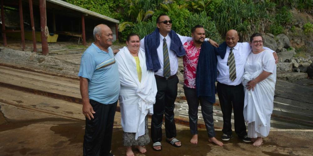 Evangelist Jean-Noel Adeline, third left, posing with baptismal candidates in Bounty Bay, Pitcairn, on Sabbath, June 2, 2018. (Melva Warren Evans / Facebook)